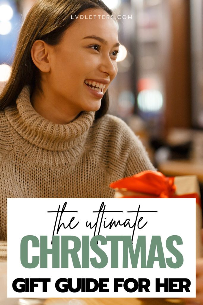 christmas gifts for girlfriend - the ultimate gift guide for her - picture of girlfriend smiling while receiving gift