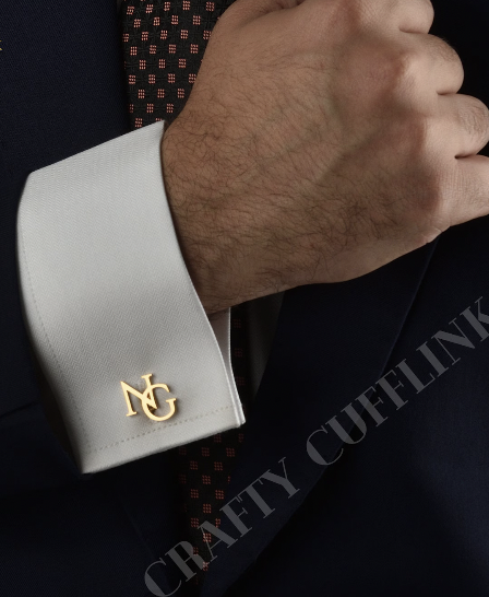34. Gold initial cufflinks